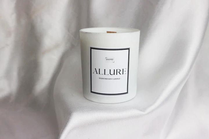 Luxurious, aromatic coconut-scented candle with a wooden wick, nestled in an elegant glass jar. The candle exudes a tropical essence, bringing a sense of relaxation and warmth. Perfect for creating a soothing ambiance in any space.